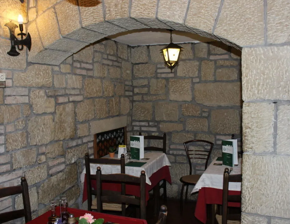 Stone and wood dining room at Buca San Francesco